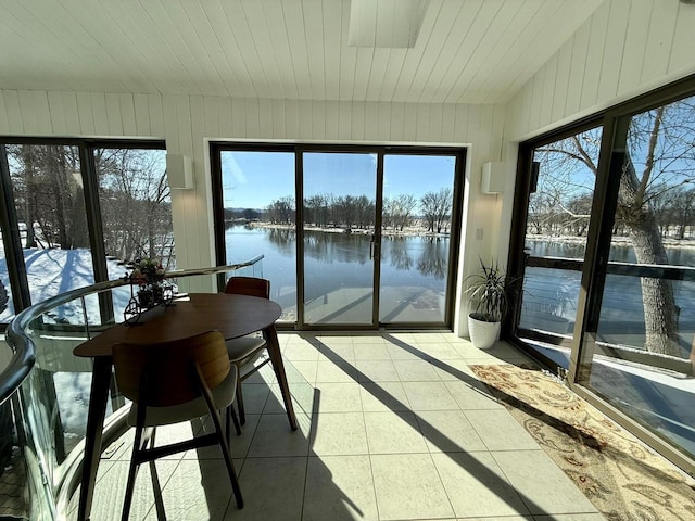 sunroom / solarium with lofted ceiling, a water view, and wood ceiling