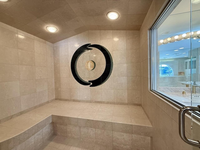 bathroom with lofted ceiling