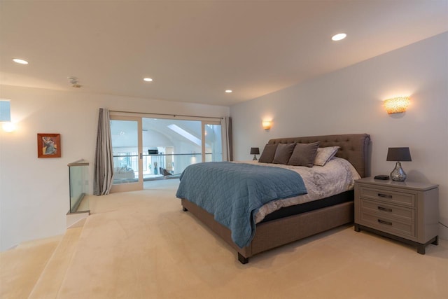 bedroom with access to exterior, recessed lighting, and light colored carpet