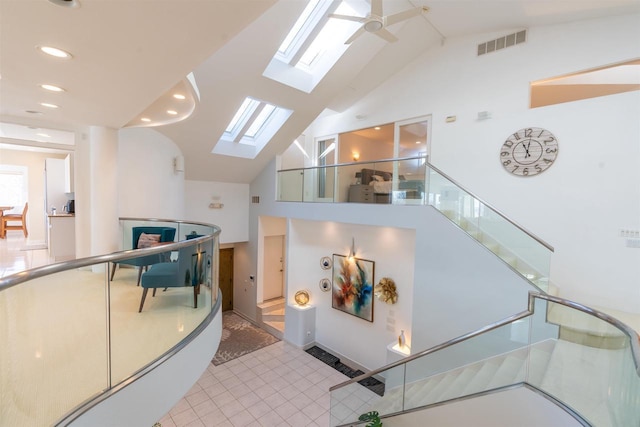 interior space with visible vents and ceiling fan