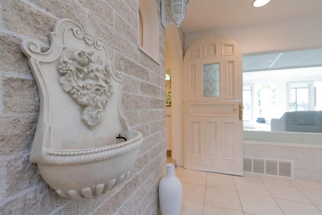 foyer entrance featuring visible vents and tile patterned floors