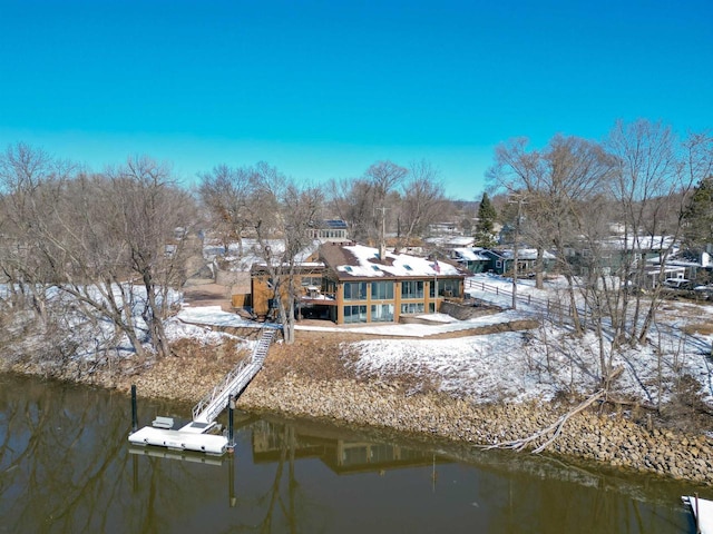 rear view of house with a water view