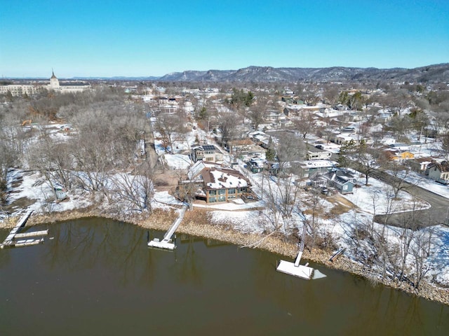 birds eye view of property featuring a water and mountain view