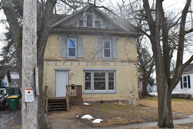 view of front of home featuring brick siding