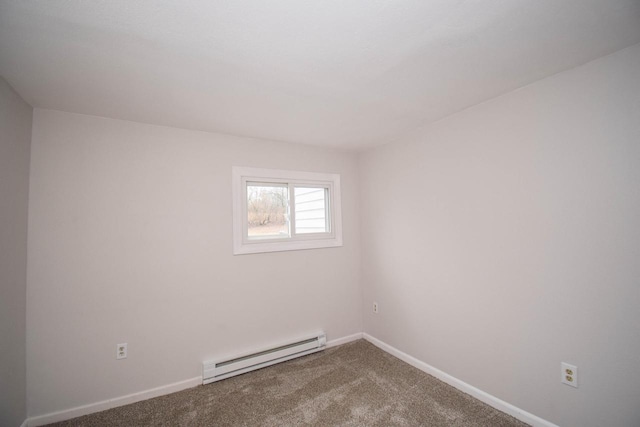 carpeted empty room with a baseboard radiator and baseboards