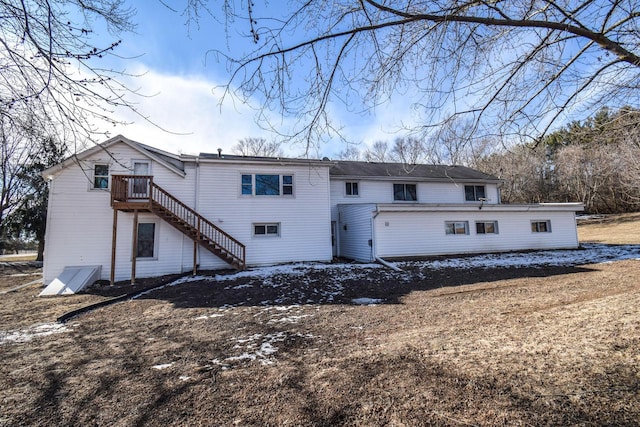 rear view of property with stairway