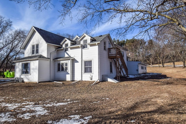 view of side of home with stairway