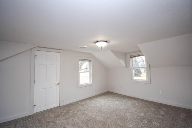 bonus room featuring carpet floors, baseboards, and a wealth of natural light