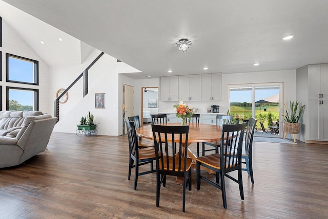 dining space featuring recessed lighting, dark wood-style flooring, and stairway