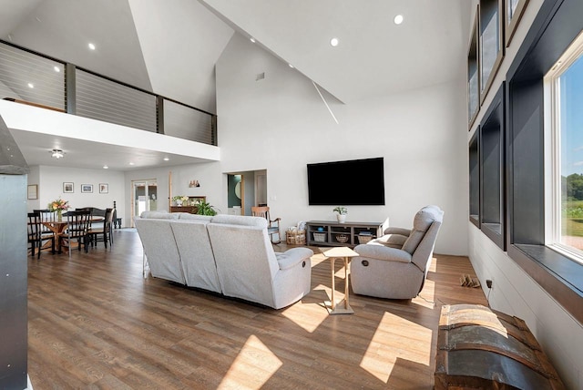 living area with wood finished floors and recessed lighting