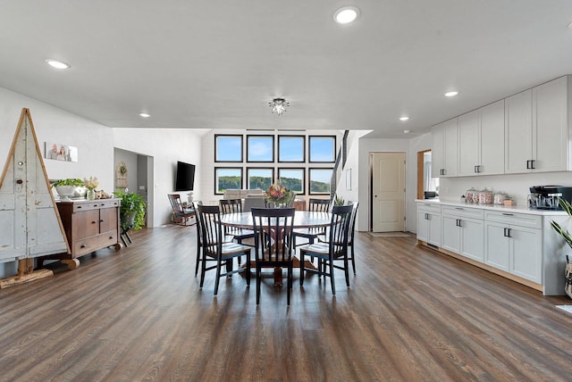 dining room with dark wood-type flooring and recessed lighting