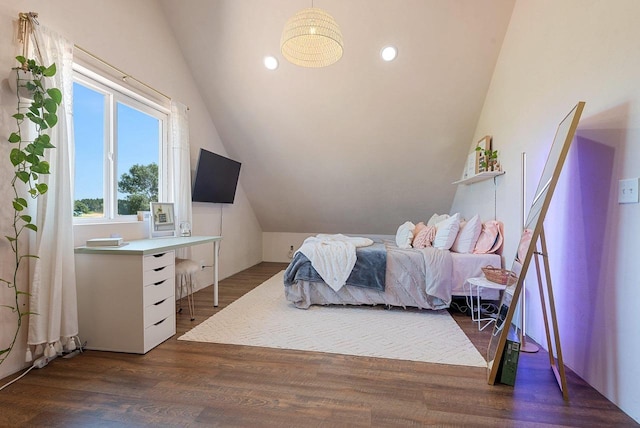 bedroom featuring vaulted ceiling, wood finished floors, and recessed lighting