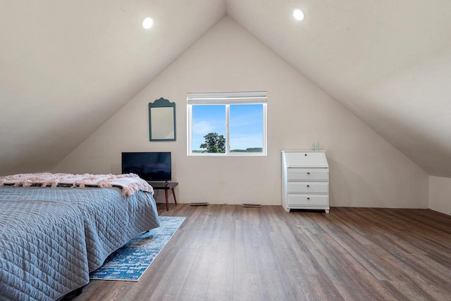 bedroom with lofted ceiling, wood finished floors, and recessed lighting