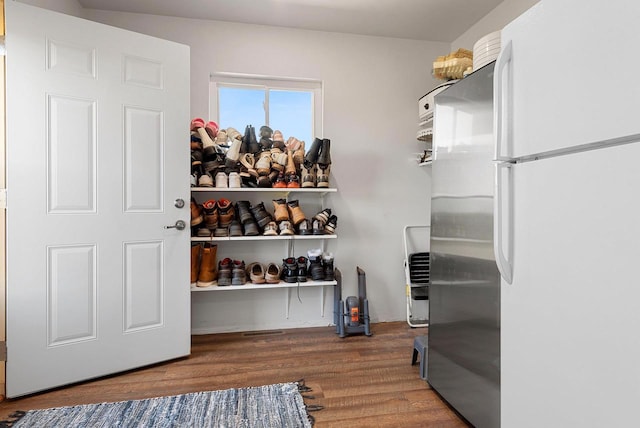 walk in closet featuring wood finished floors