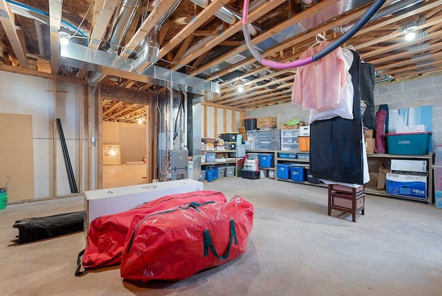 unfinished basement featuring heating unit