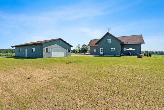 view of yard with a garage and an outdoor structure