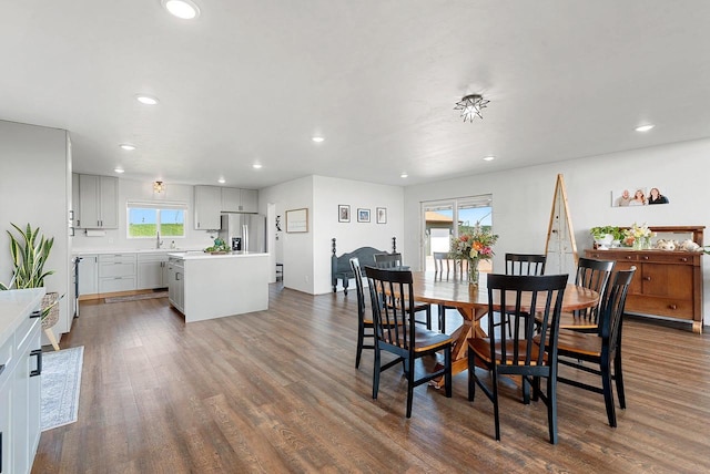 dining room with recessed lighting and dark wood finished floors