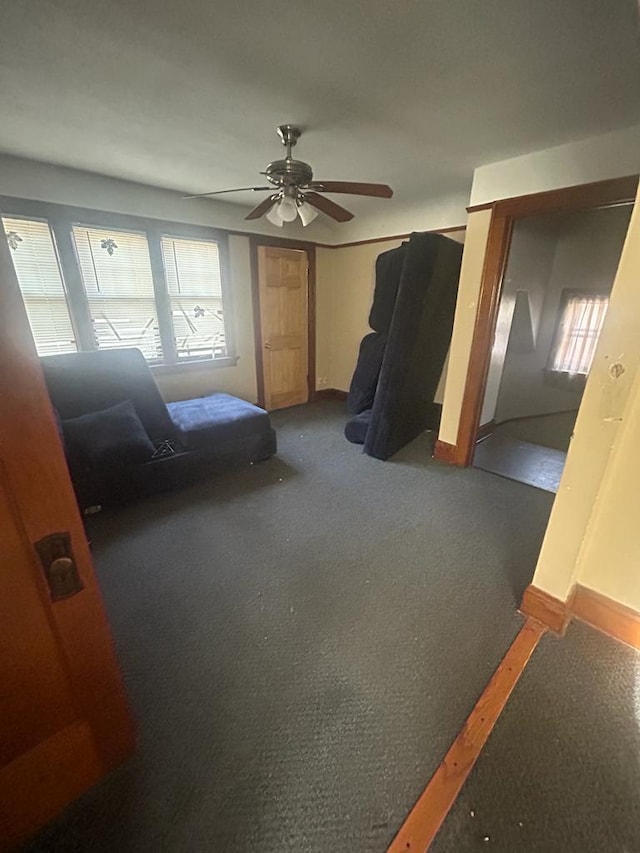 bedroom featuring multiple windows, ceiling fan, and baseboards