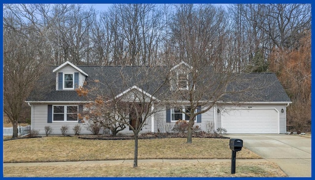 cape cod home with a front lawn, driveway, a shingled roof, and an attached garage