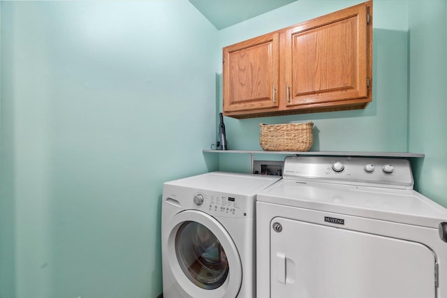 laundry area with cabinet space and washer and clothes dryer