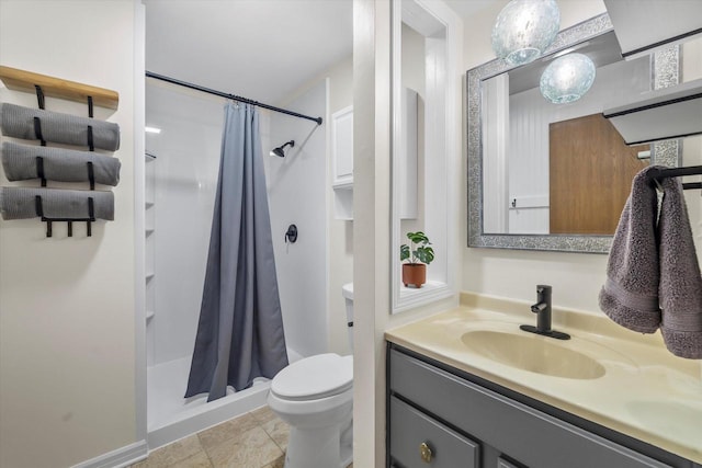 bathroom with toilet, a stall shower, baseboards, and vanity