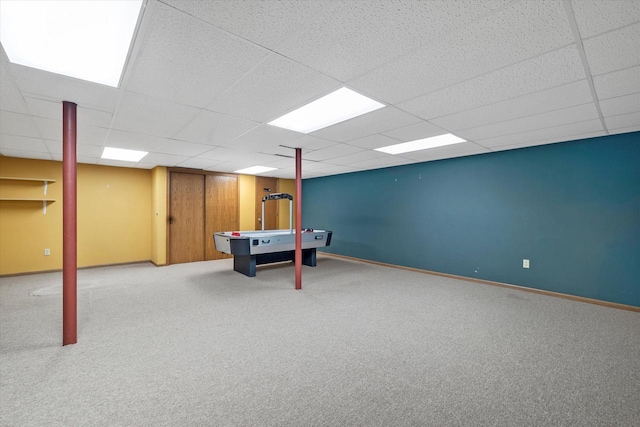 game room with carpet flooring, a paneled ceiling, and baseboards