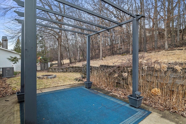 view of patio / terrace with cooling unit and a pergola