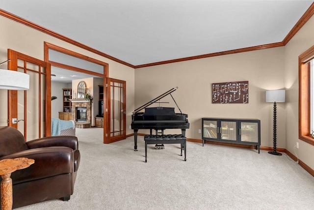 sitting room featuring ornamental molding, carpet, a fireplace, and baseboards