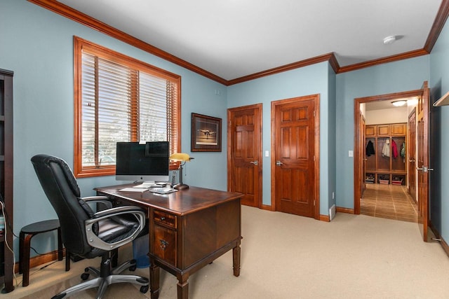 office with baseboards, ornamental molding, and light colored carpet