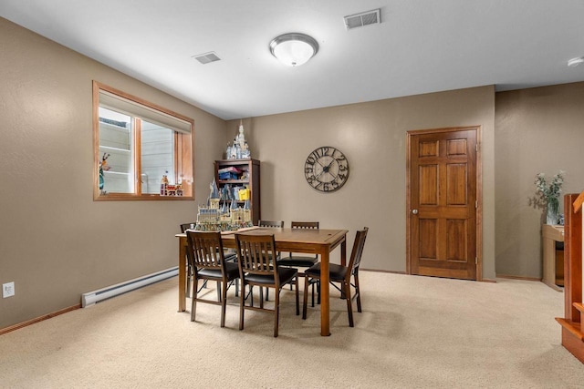 dining area featuring a baseboard radiator, baseboards, visible vents, and carpet flooring