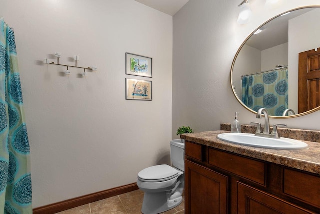 full bath with toilet, vanity, baseboards, and tile patterned floors