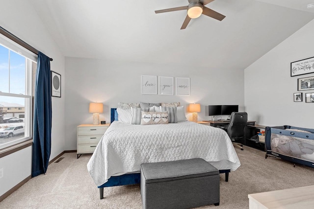 bedroom with visible vents, baseboards, light colored carpet, ceiling fan, and vaulted ceiling