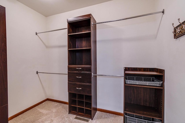 spacious closet with carpet floors and visible vents