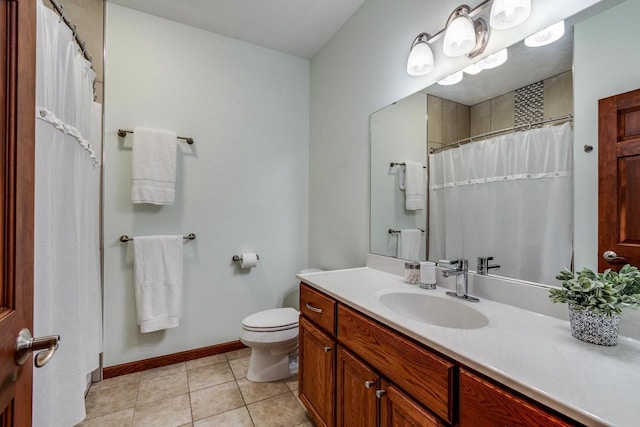 bathroom featuring tile patterned flooring, toilet, vanity, baseboards, and a shower with curtain