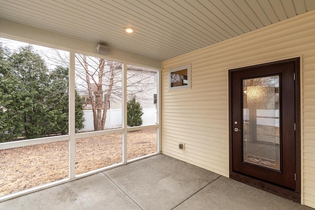 unfurnished sunroom featuring wooden ceiling