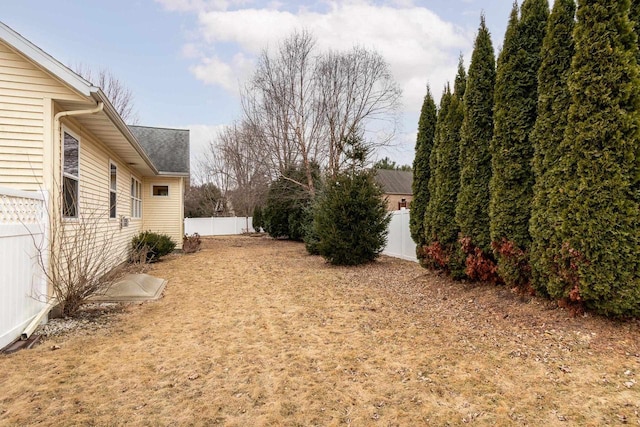 view of yard with a fenced backyard