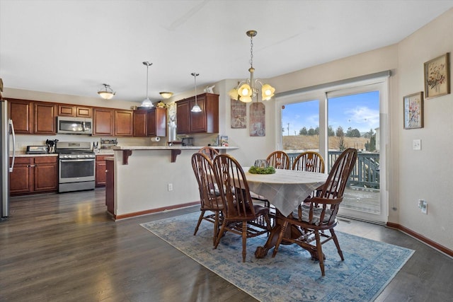 dining room with dark wood-style floors, baseboards, and an inviting chandelier