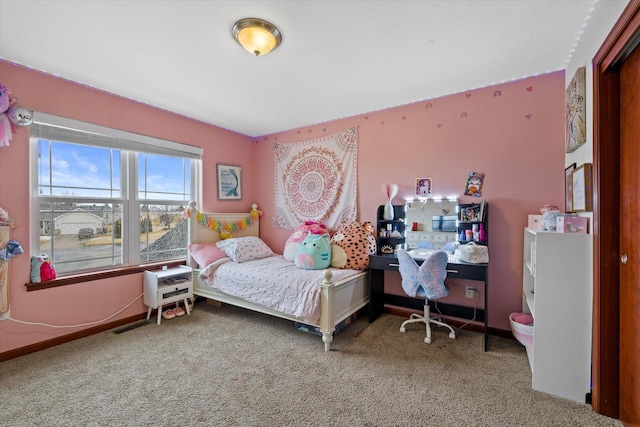 bedroom featuring carpet flooring and baseboards