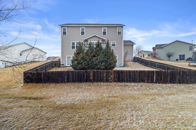 back of property featuring fence