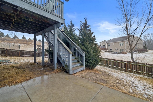 view of yard featuring a patio area, a fenced backyard, and stairs