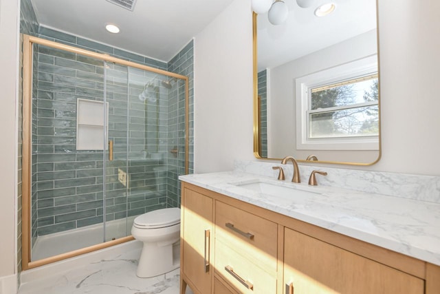 full bathroom with toilet, marble finish floor, a stall shower, and vanity