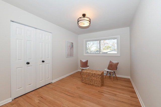 sitting room featuring light wood-style floors and baseboards