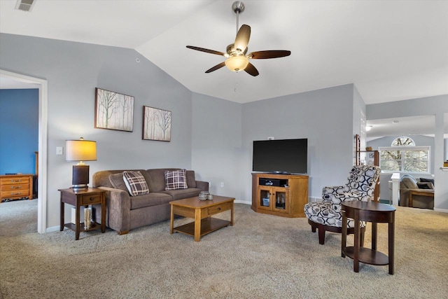 carpeted living area featuring lofted ceiling, visible vents, baseboards, and a ceiling fan