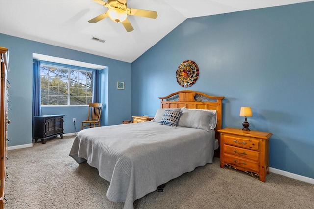 bedroom featuring carpet, visible vents, vaulted ceiling, and baseboards