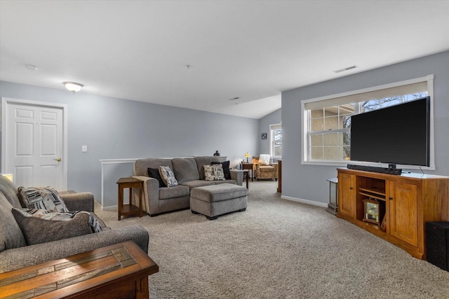 carpeted living area featuring lofted ceiling, baseboards, and visible vents