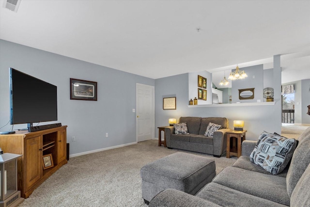 carpeted living room with a chandelier, visible vents, and baseboards