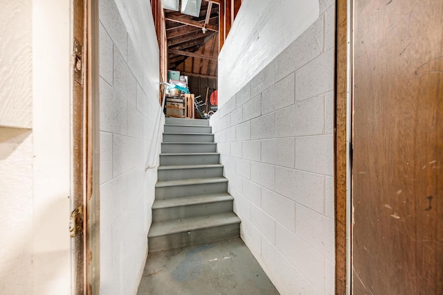 stairway with concrete block wall and concrete flooring