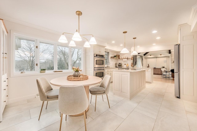 dining room featuring light tile patterned flooring, a toaster, recessed lighting, baseboards, and crown molding