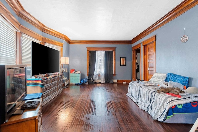 bedroom with wood-type flooring, baseboards, and crown molding