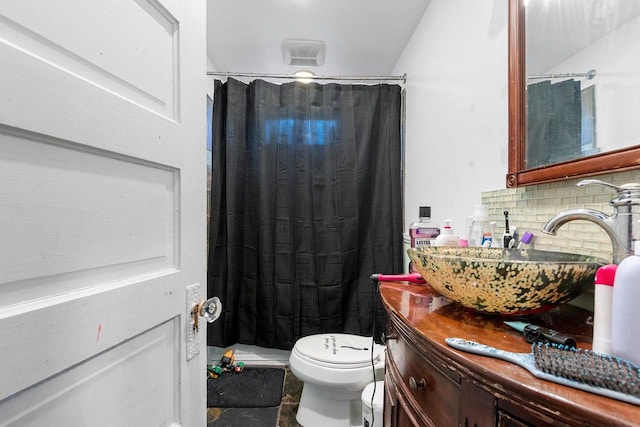 bathroom featuring toilet, a shower with curtain, tasteful backsplash, and vanity